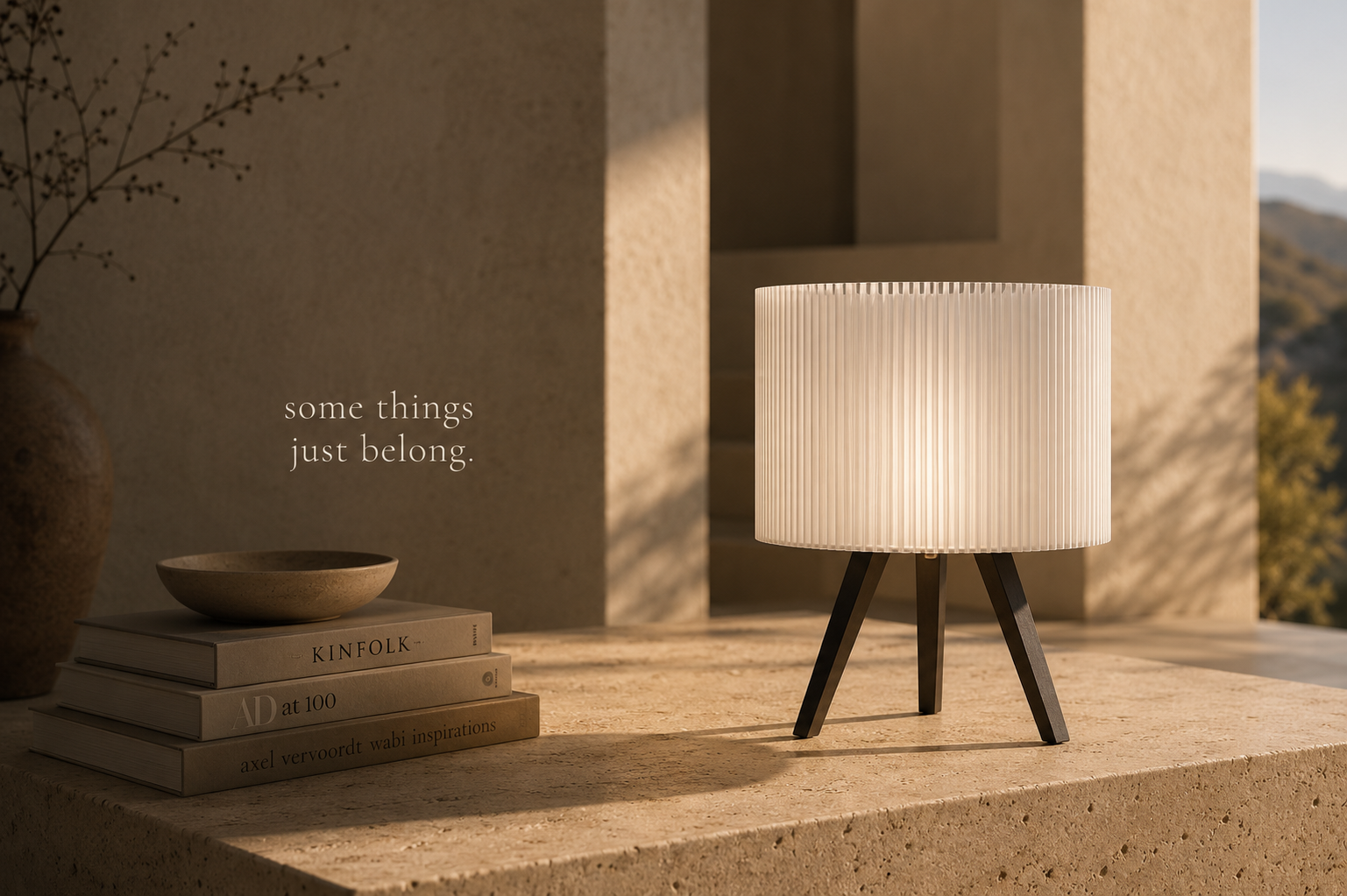Orbit White table lamp glowing in a bright interior.