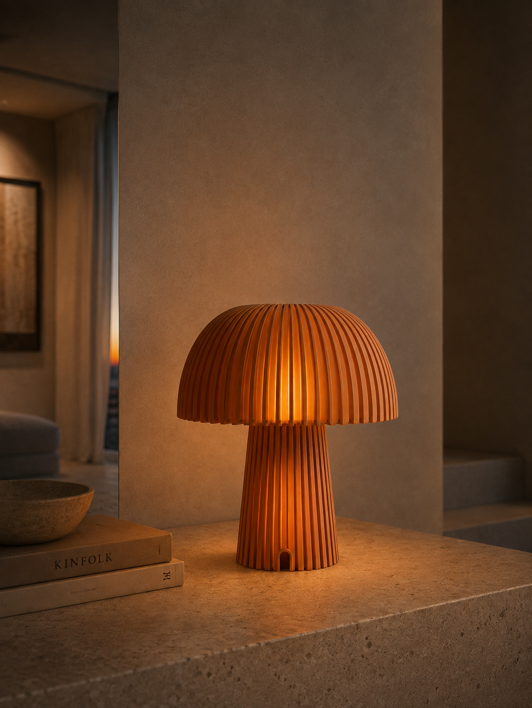 Maxi Mush Terracotta table lamp glowing on a travertine ledge.